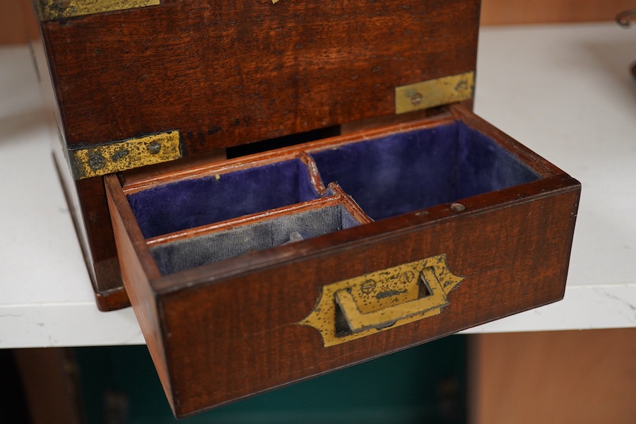 An early 19th century mahogany apothecary box, containing ten glass bottles, one with original paper label for the chemist Elam, 196 Oxford Street, London, with draw beneath containing a pair of scales, and weights, etc.